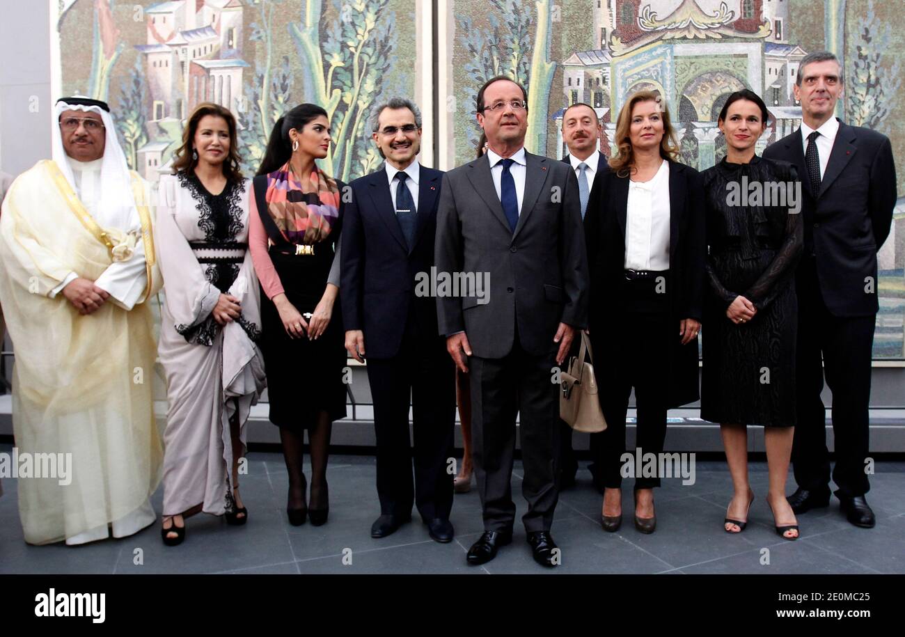 France's President Francois Hollande (C), his companion Valerie Trierweiler (2ndR), Culture minister Aurelie Filippetti (R), Louvre museum's president Henri Loyrette, Saudi billionaire Prince Waleed bin Talal (3rdL) and his wife Princess Amira al-Taweel (2ndL), and Moroccan Princess Lalla Meryem (L) pictured during the official opening ceremony of the new Department of Islamic Arts galleries at the Louvre museum, Paris, France on September 18, 2012. The new Louvre department is the largest of its kind in Europe, with 3,000 artefacts on display, gathered from Spain to India and dating back to t Stock Photo