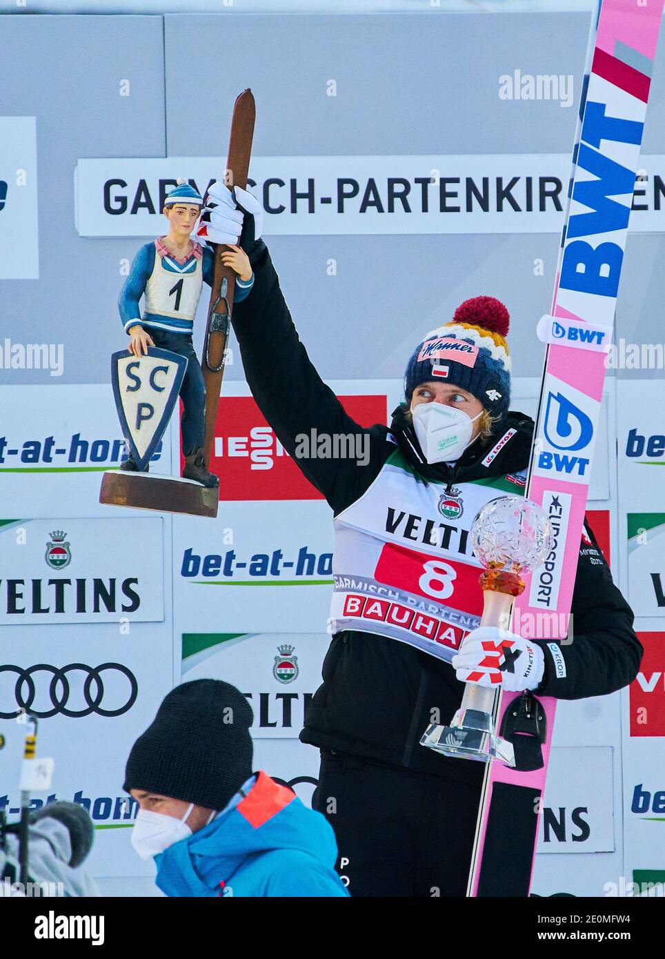 Winner ceremony with winner Dawid KUBACKI, POL gets a trophy of Felix NEUREUTHER, GER alpine skier and 2.place Halvor Egner GRANERUD, NOR, 3.place Piotr ZYLA, POL at the Four Hills Tournament Ski Jumping at Olympic Stadium, Grosse Olympiaschanze in Garmisch-Partenkirchen, Bavaria, Germany, January 01, 2021.  © Peter Schatz / Alamy Live News Stock Photo