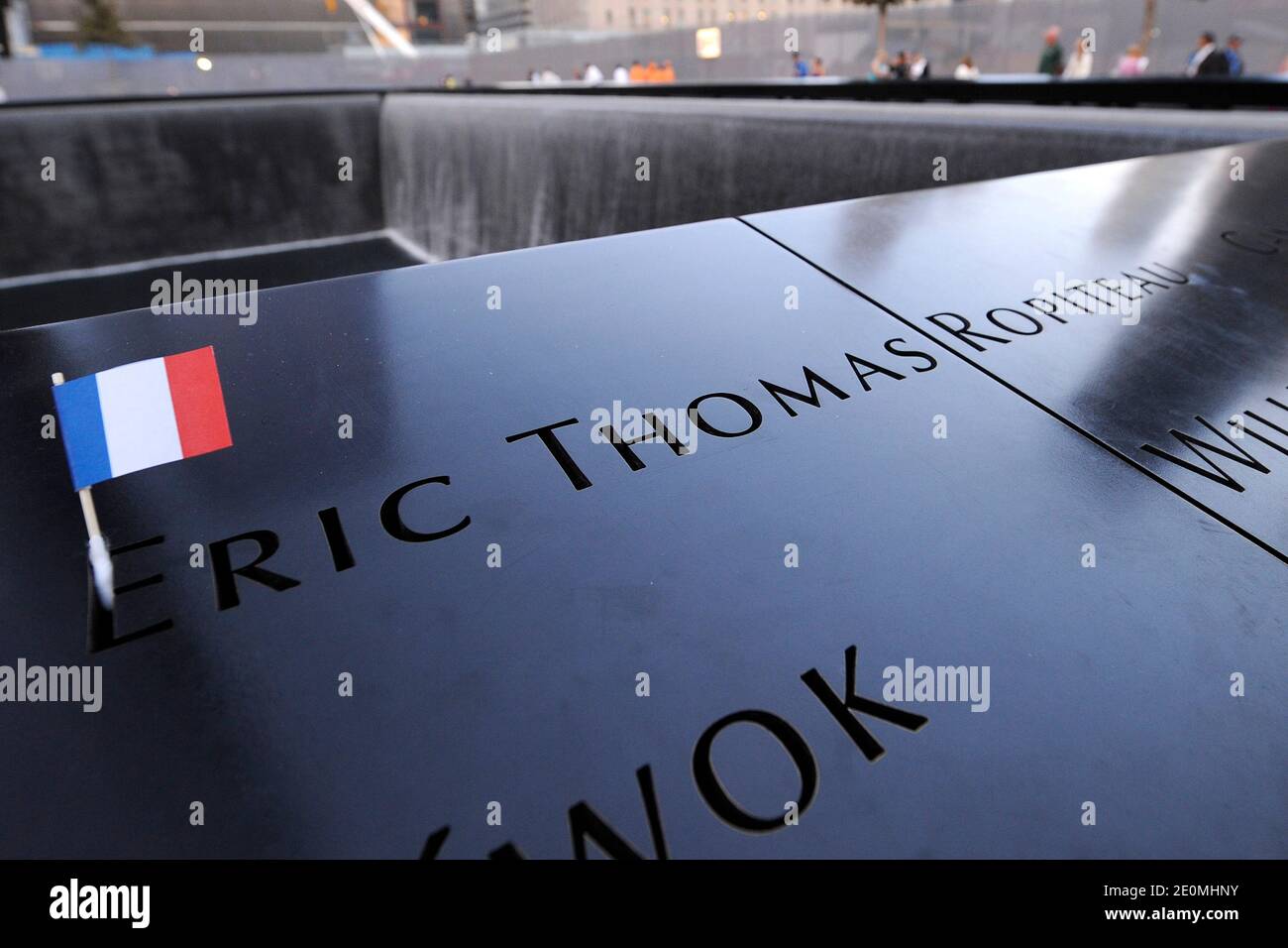 A French flag highlights the name of Eric Thomas Ropiteau where French President Francois Hollande is expected to visit Ground Zero 911 Memorial Park on September 25, 2012, New York, NY, USA. Photo by Anthony Behar/Pool/ABACAPRESS.COM Stock Photo