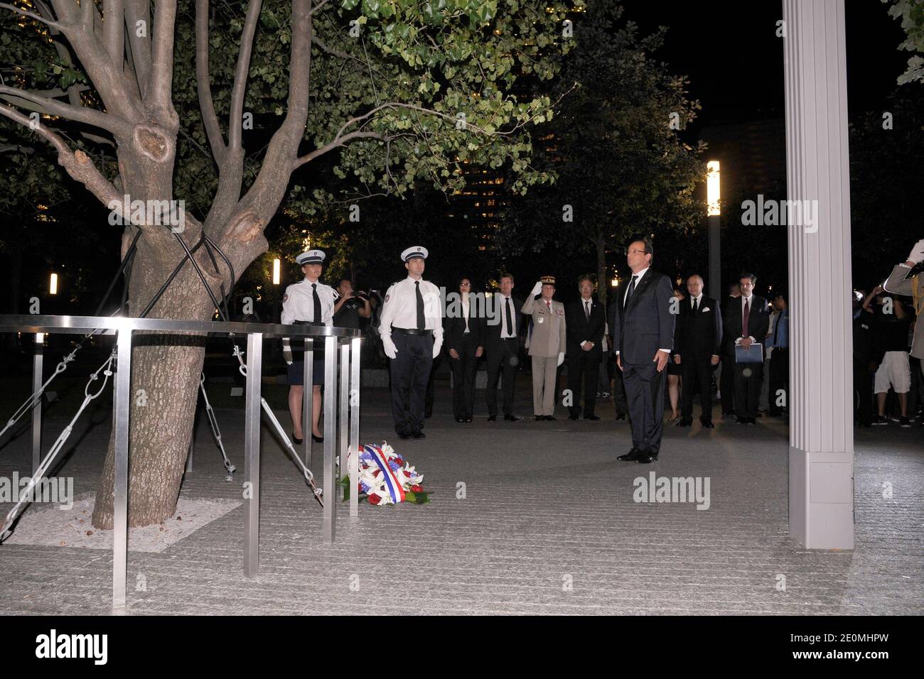 French President Francois Hollande stand in silence after laying a memorial wreath during his visit to the Ground Zero 911 Memorial Park on September 25, 2012, New York, NY, USA. Photo by Anthony Behar/Pool/ABACAPRESS.COM Stock Photo