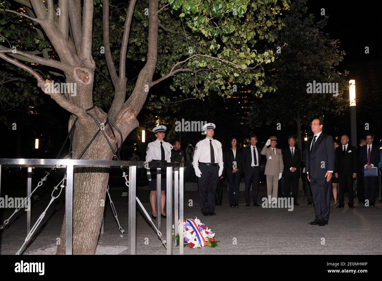 French President Francois Hollande stand in silence after laying a memorial wreath during his visit to the Ground Zero 911 Memorial Park on September 25, 2012, New York, NY, USA. Photo by Anthony Behar/Pool/ABACAPRESS.COM Stock Photo