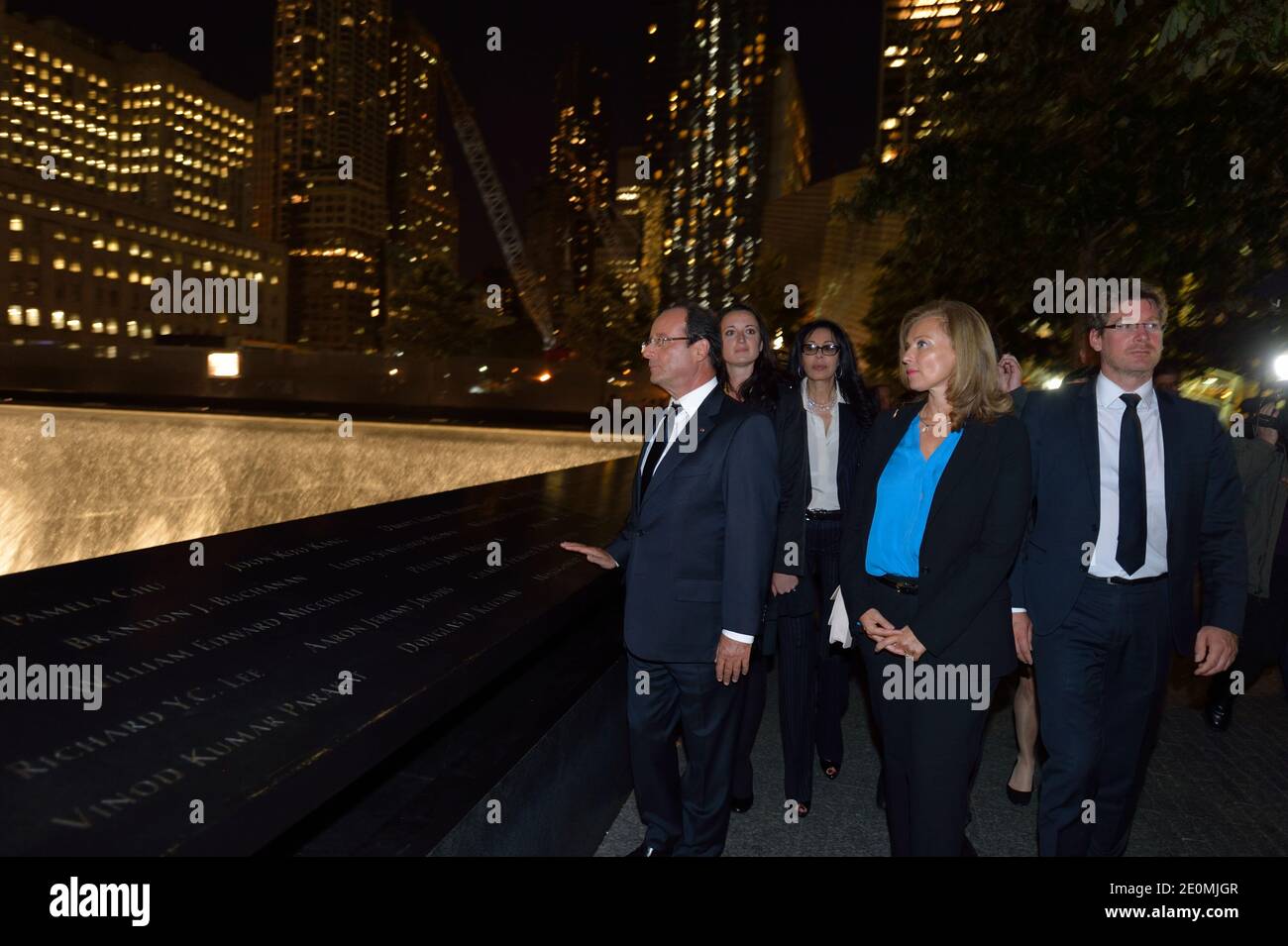 French President Francois Hollande, his companion Valerie Trierweiler and French Junior Minister for Foreign Countries and Development Pascal Canfin visit Ground Zero in New York, NY, US on September 25, 2012 the site of the Twin Towers that were destroyed on September 11, 2001. Photo by Eric Feferberg/Pool/ABACAPRESS.COM Stock Photo