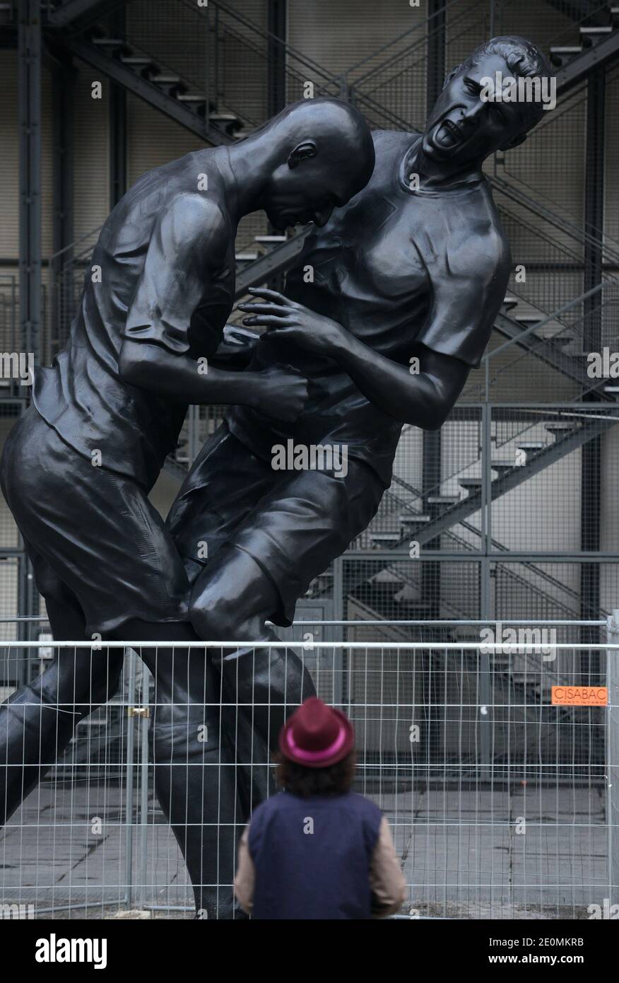 A bronze sculpture by Algerian artist Adel Abdessemed is on display in front of the Centre Pompidou contemporary art center, aka Beaubourg in Paris, France, September 26, 2012. The sculpture immortalizes the 'headbutt' given by the French former football champion Zinedine Zidane to Italian player Materazzi during the World Cup final in 2006. The Centre Pompidou will dedicate a retrospective to Abdessemed from October 3, 2012 to January 7, 2013. Photo by Mousse/ABACAPRESS.COM Stock Photo