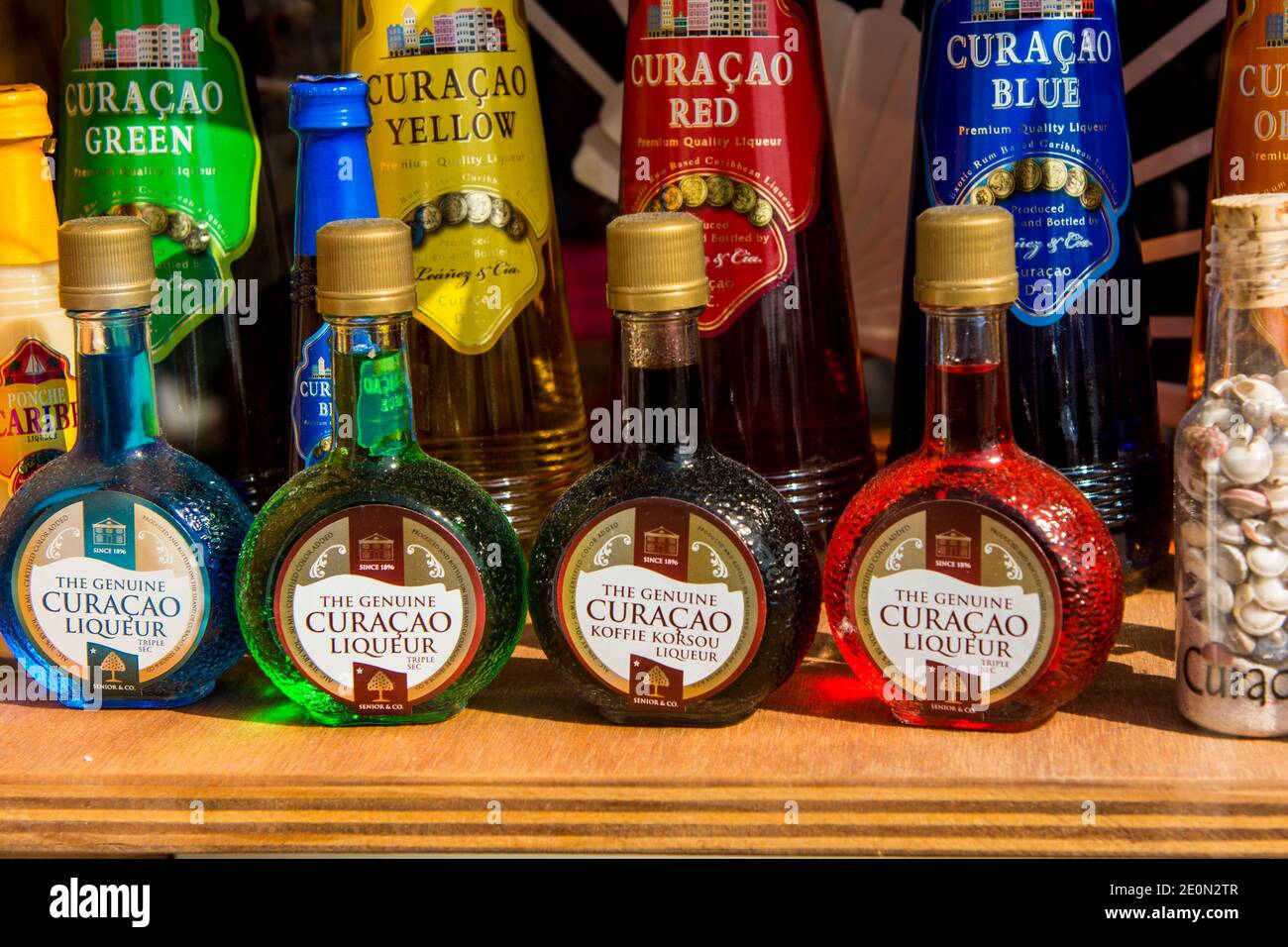 Bottles of Curacao liqueur liquor alcohol in the craft market