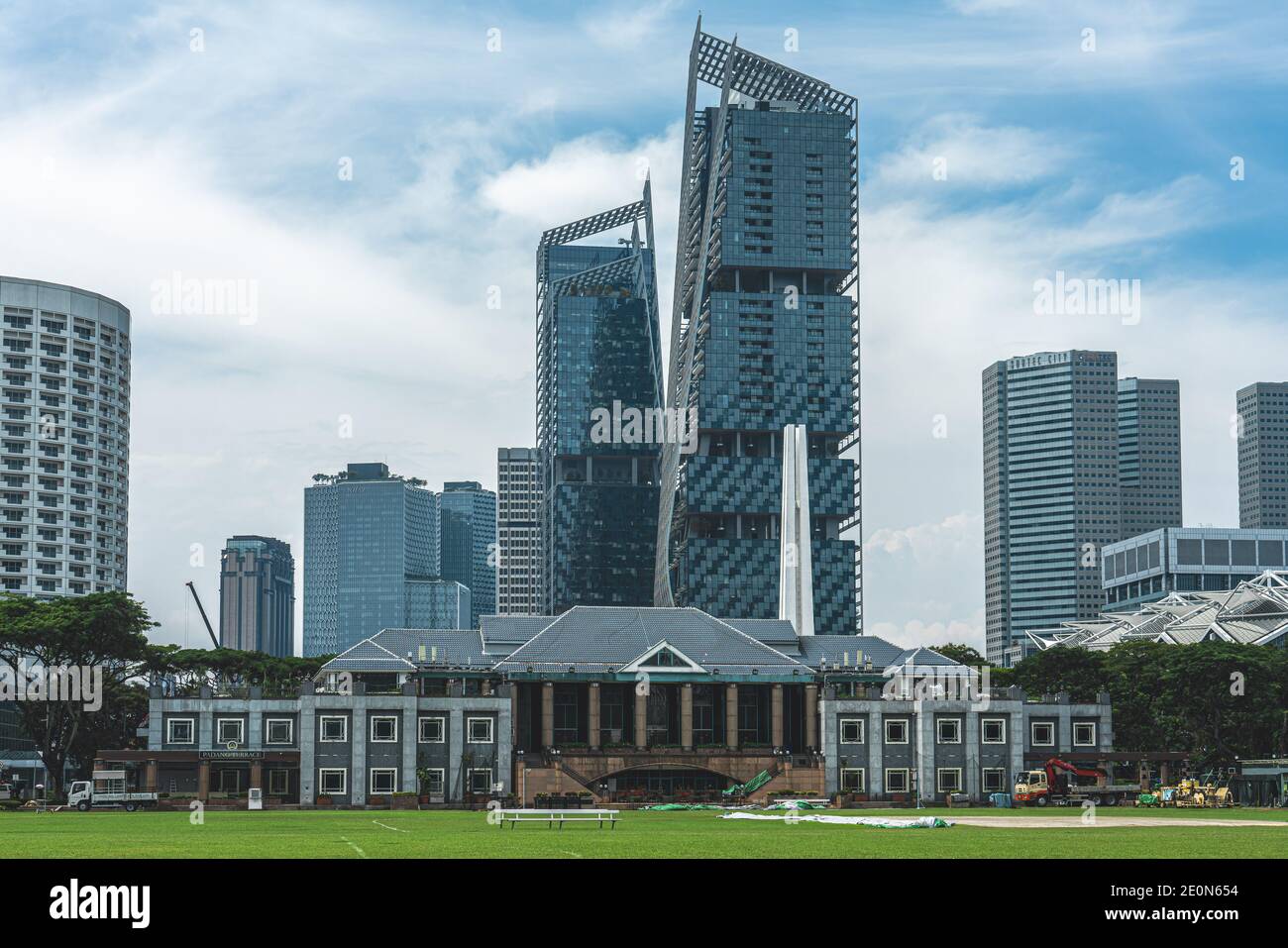 Padang  / Singapore - May 21 2018: Singapore Recreation Club building with Grass infront and skyscrapers in the back Stock Photo