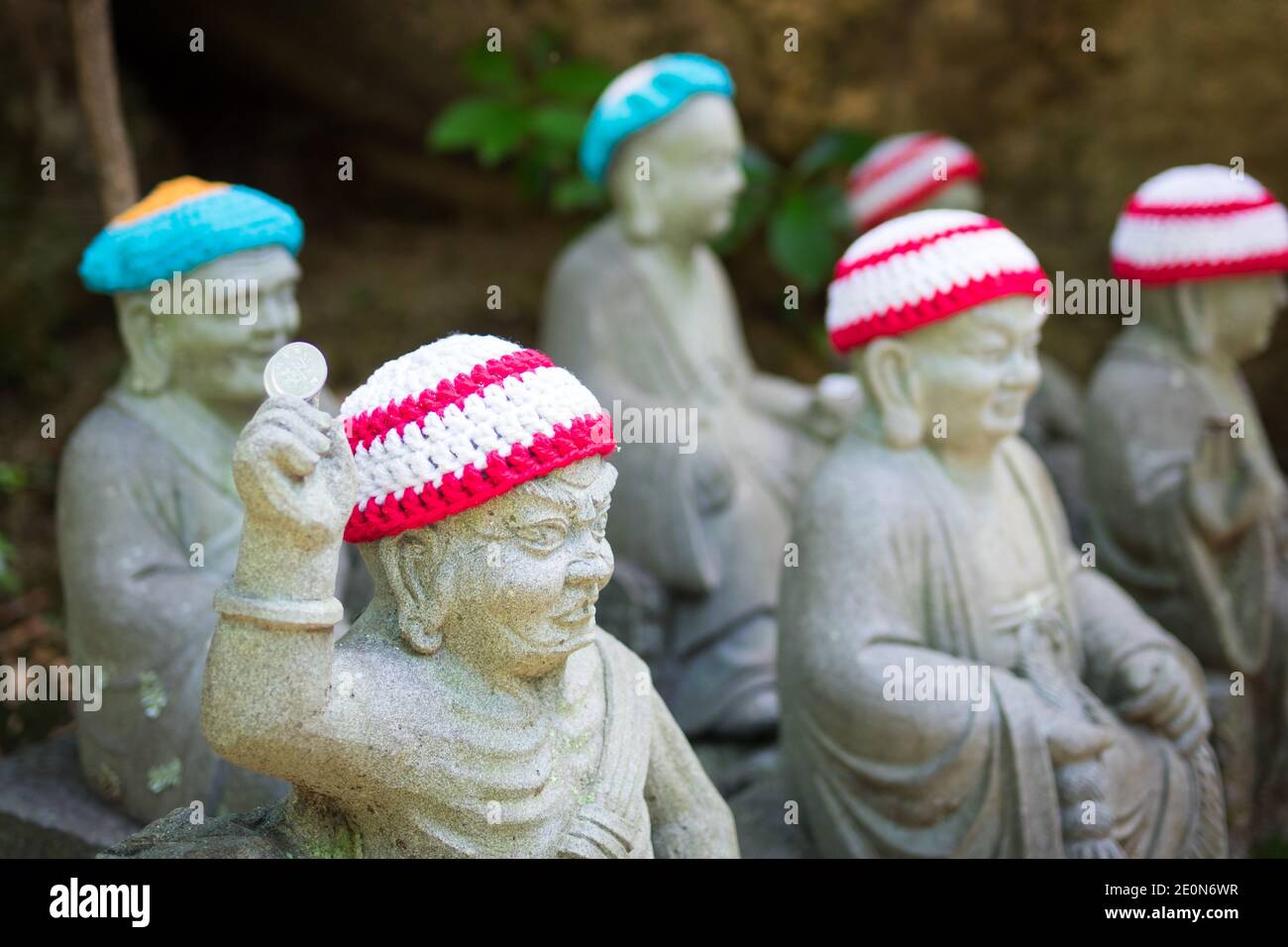 Statues of the original followers of Buddha (called Shaka Nyorai in Japan), with knitted caps at Daisho-in Temple (Daishoin Temple), Miyajima, Japan. Stock Photo