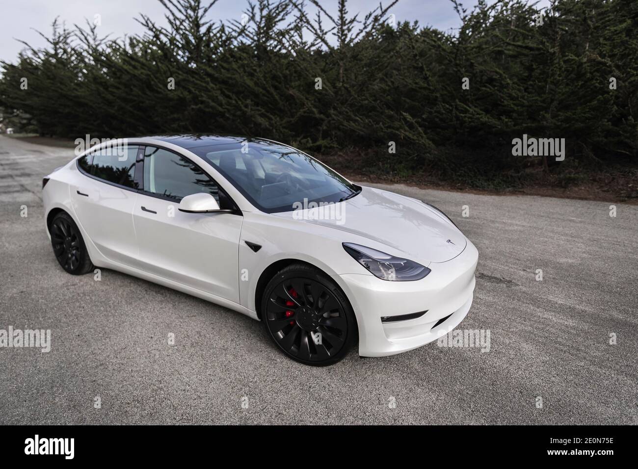 Moss Beach USA January 1 2021 Pearl white electric Tesla Model