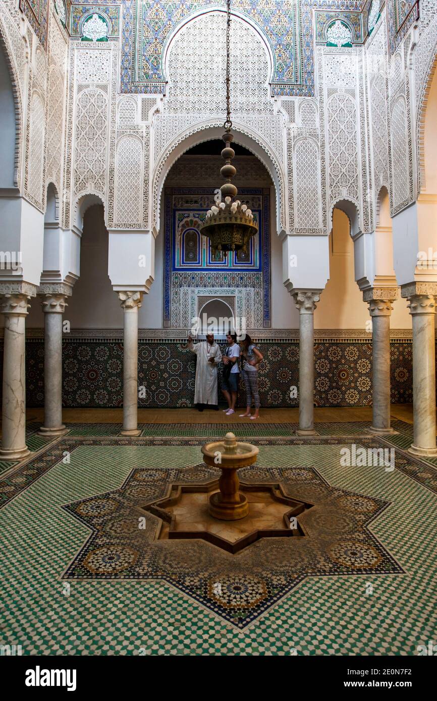 The tiled interior and fountain of one of the courts in the Mausoleum of Moulay Ismail at Meknes, Morocco. Moulay Ismail was the Sultanate of Morocco. Stock Photo