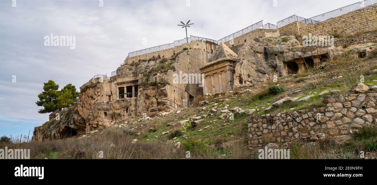 Jerusalem, Israel - December 17th, 2020: Ancient tombs and burial caves around the tombs of the sons of Hezir and of Zechariah, in the Kidron valley, Stock Photo