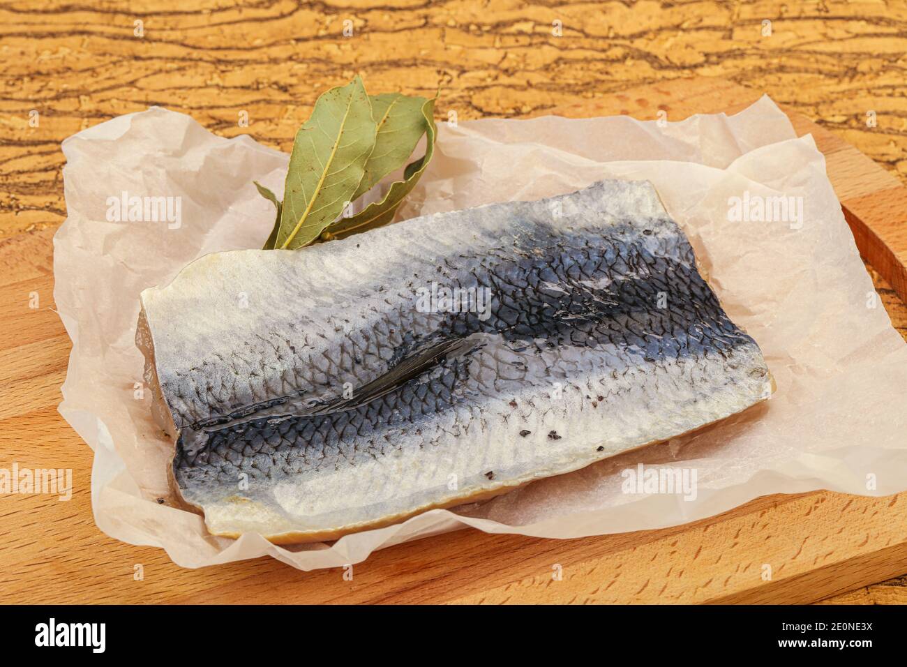 Herring fillet with skin and spices over board Stock Photo Alamy