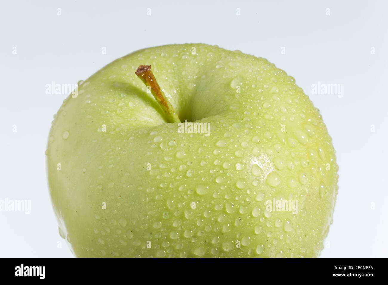 fresh green apple on a white background Stock Photo - Alamy