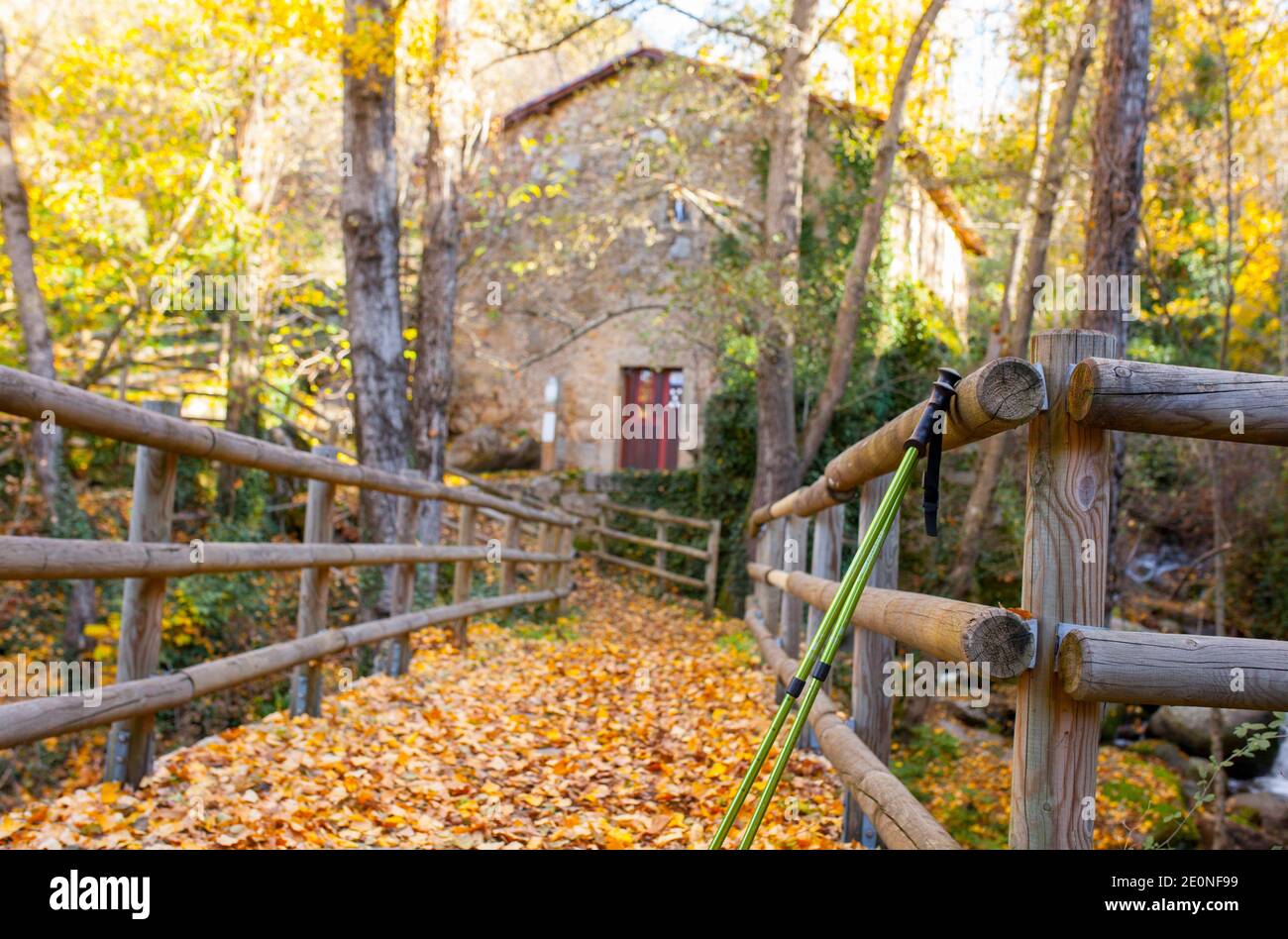 Trekking poles at old Banos de Montemayor watermill. Magic autumn of Ambroz Valley, Extremadura, Spain. Stock Photo