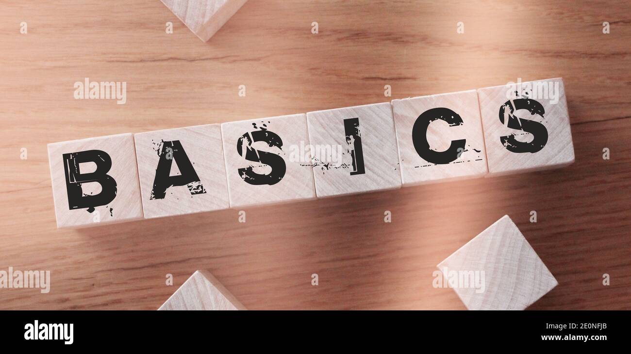 BASIC word on a wooden blocks on a light background. Stock Photo