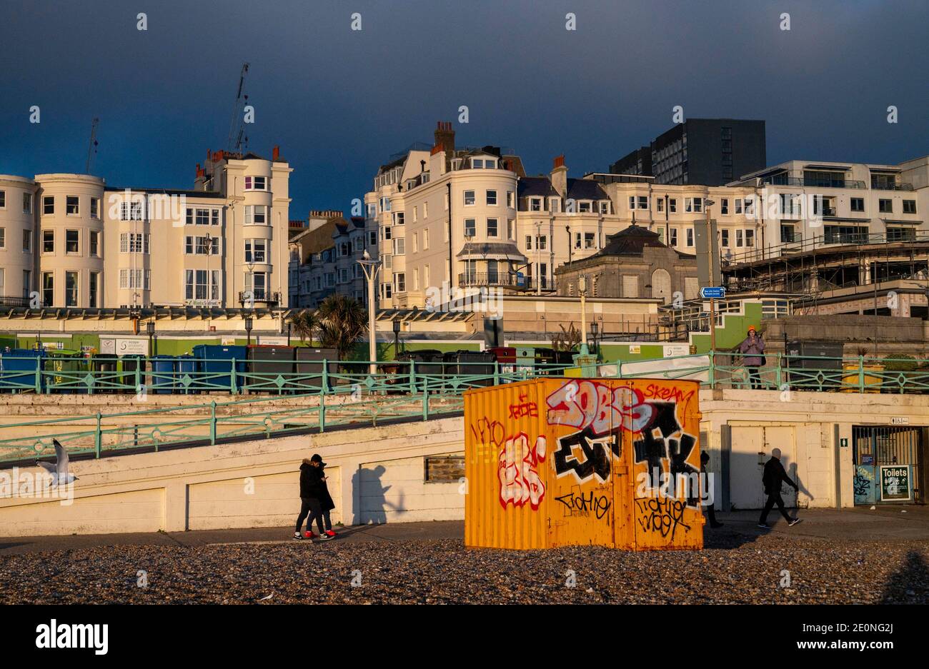 Brighton seafront and container with late afternoon winter sunshine on New Years Eve December 2020   Photograph taken by Simon Dack Stock Photo