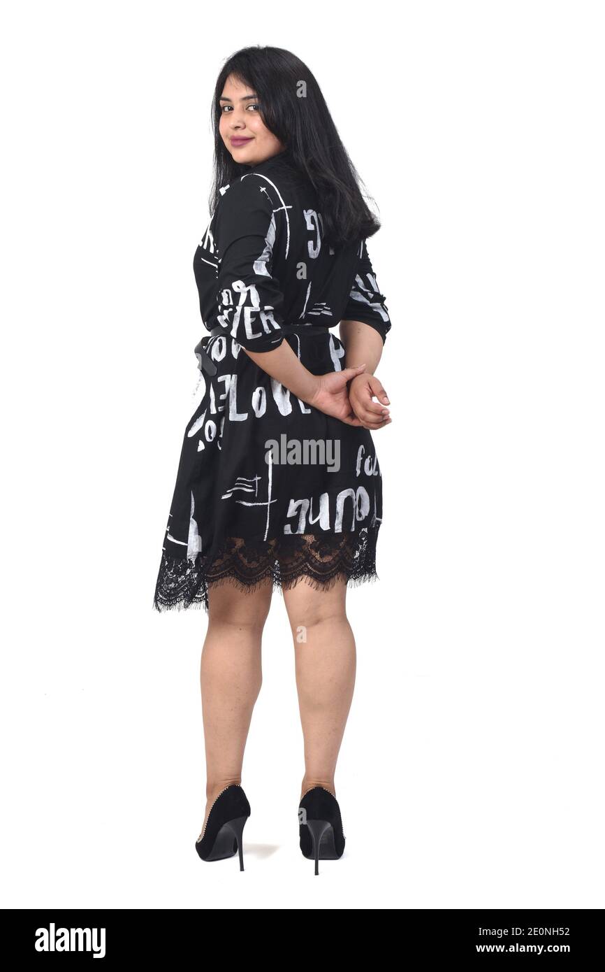 rear view of latin woman with dress and high heels on white background