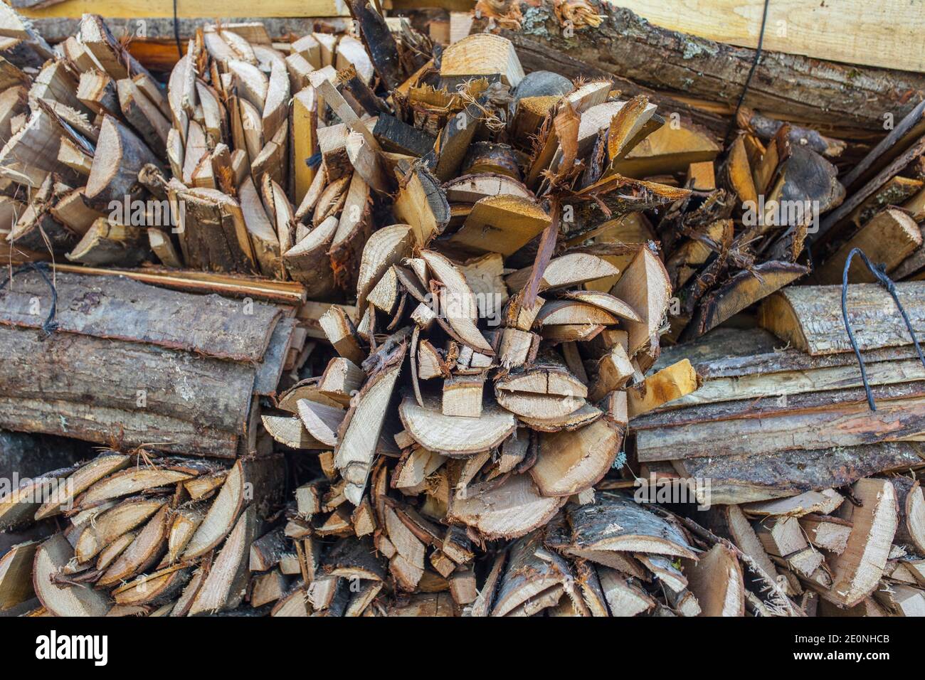 Bundle of split logs sold as firewood. Closeup. Stock Photo