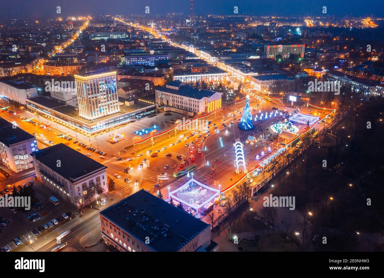 Gomel, Belarus. Main Christmas Tree And Festive Illumination On Lenin Square In Homel. New Year Celebration In Belarus. Aerial Night View. Stock Photo