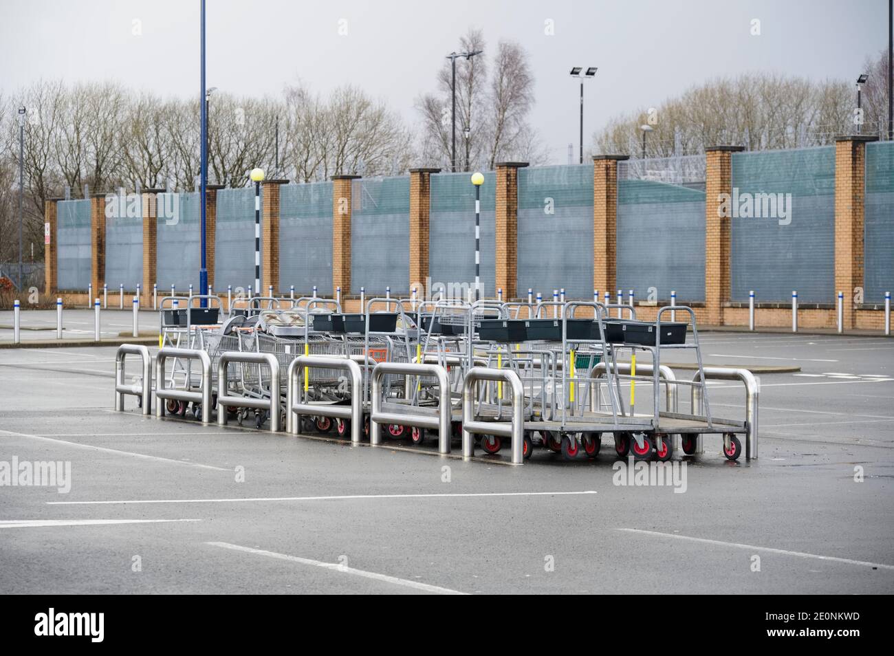 Shopping trolley group at closed shop car park empty due to covid-19 Stock Photo