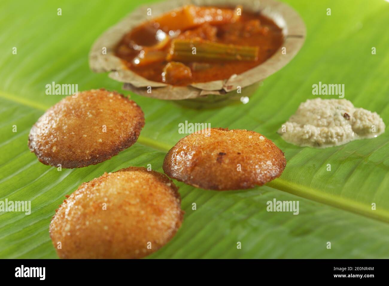 South Indian fast food fried idly with coconut chutney and sambar on