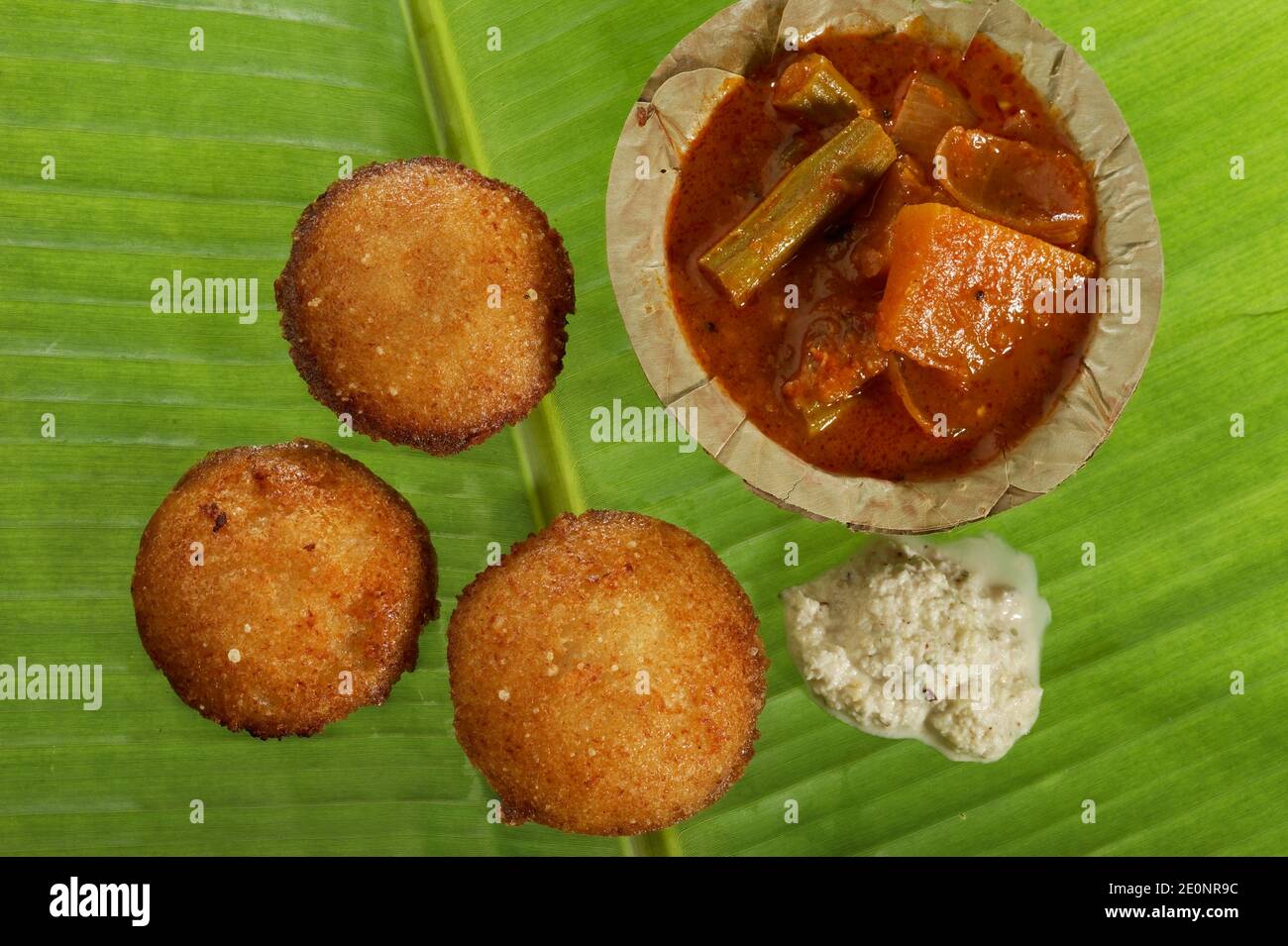South Indian fast food fried idly with coconut chutney and sambar on