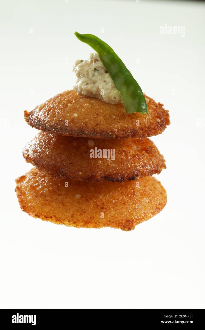 South Indian fast food fried idly with coconut chutney and sambar on