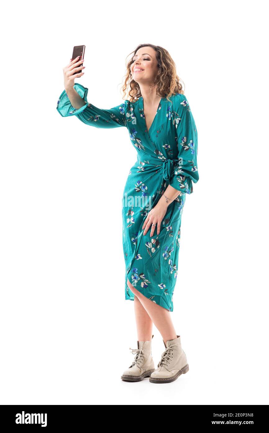 Happy pretty young woman taking selfies photos with smart phone smiles