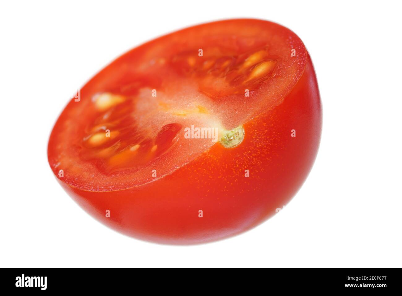Single red cherry tomato half, isolated on white background Stock Photo