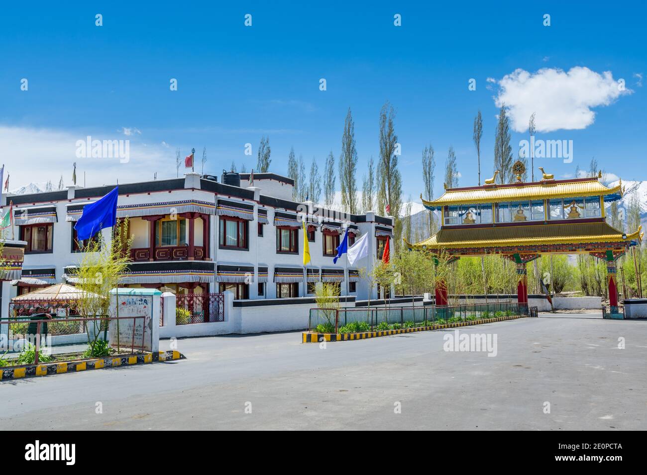 Tibetan buildings of CHAMBA Hotel and Restaurant in front of Thiksey Monastery or Thiksey Gompa, A famous Tibetan temple in Ladakh, India Stock Photo