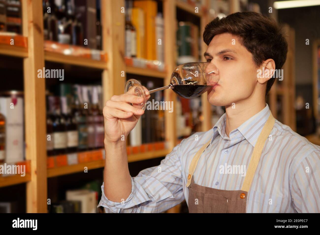 Professional sommelier tasting red wine hires stock photography and