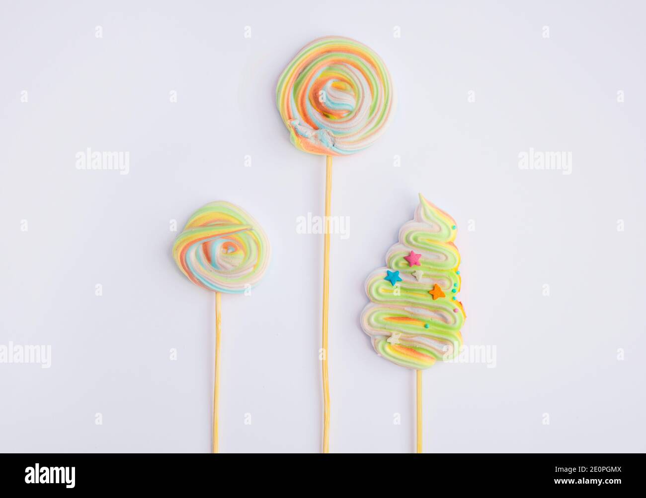 Colored bright meringues on a white background Stock Photo