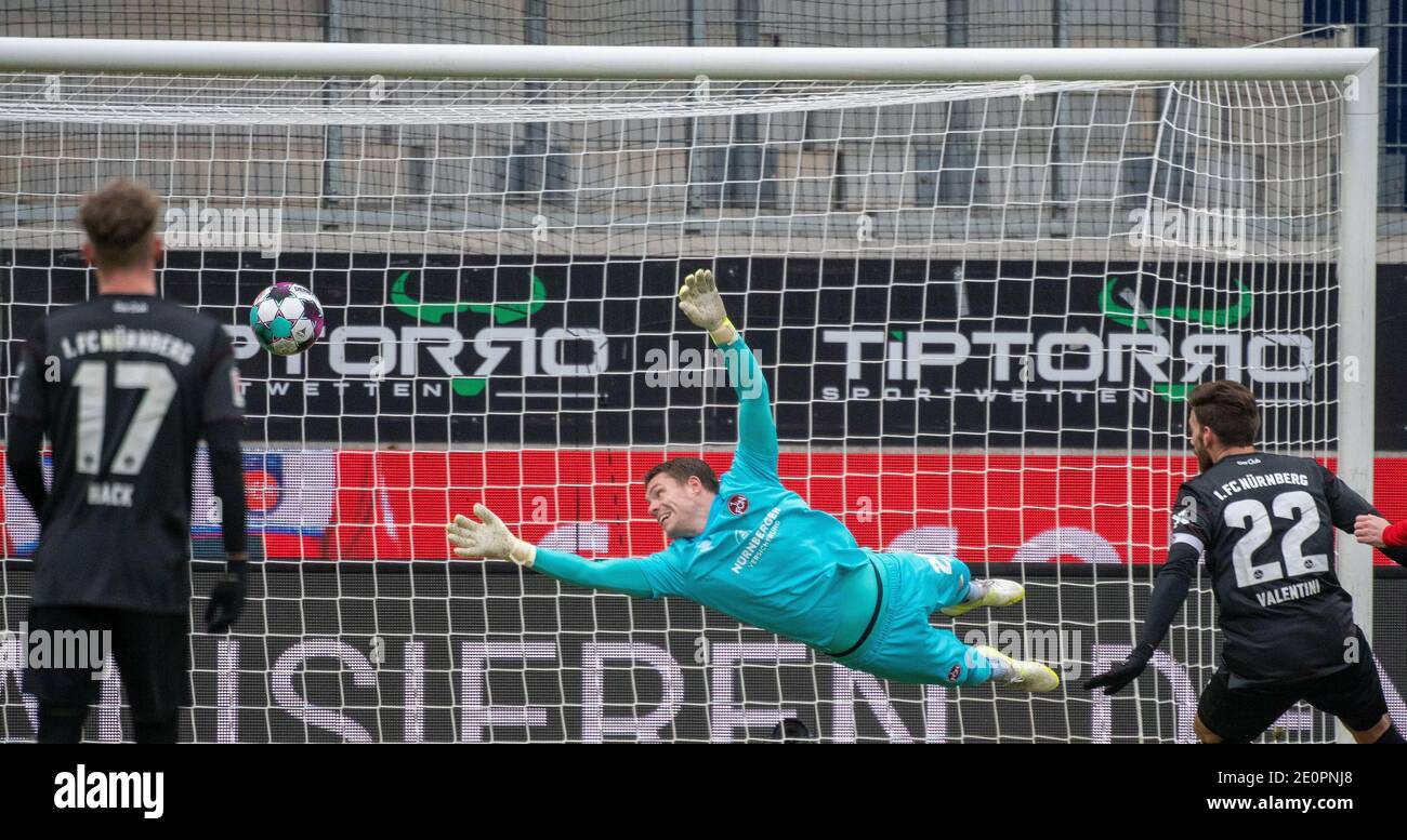 Heidenheim, Germany. 02nd Jan, 2021. Football: 2. Bundesliga, 1. FC Heidenheim - 1. FC Nürnberg, Matchday 14 at Voith Arena. Nuremberg's goalkeeper Christian Mathenia watches the ball. Credit: Stefan Puchner/dpa - IMPORTANT NOTE: In accordance with the regulations of the DFL Deutsche Fußball Liga and/or the DFB Deutscher Fußball-Bund, it is prohibited to use or have used photographs taken in the stadium and/or of the match in the form of sequence pictures and/or video-like photo series./dpa/Alamy Live News Stock Photo