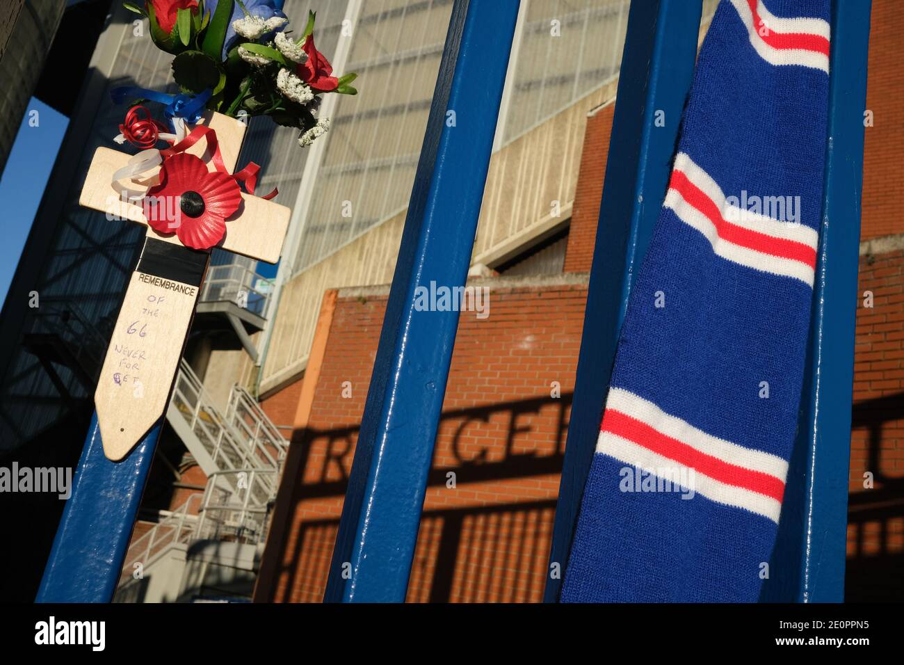 Glasgow, UK, 2 January 2021. Supporters of Rangers Football Club tie scarves on the club's stadium gate, in memory of those 66 fans who lost their life in the Ibrox Stadium disaster which happened 50-years ago today on 2nd January 1971. The anniversary falls on the day that Rangers FC plays their rivals Celtic FC, at home, in a League game. Photo: JeremyS utton-Hibbert/Alamy Live News. Stock Photo
