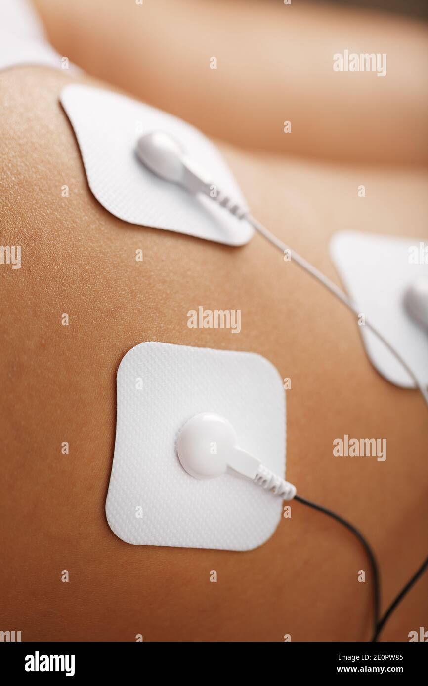 Muscle stimulator with electrodes, the massager on the buttocks and