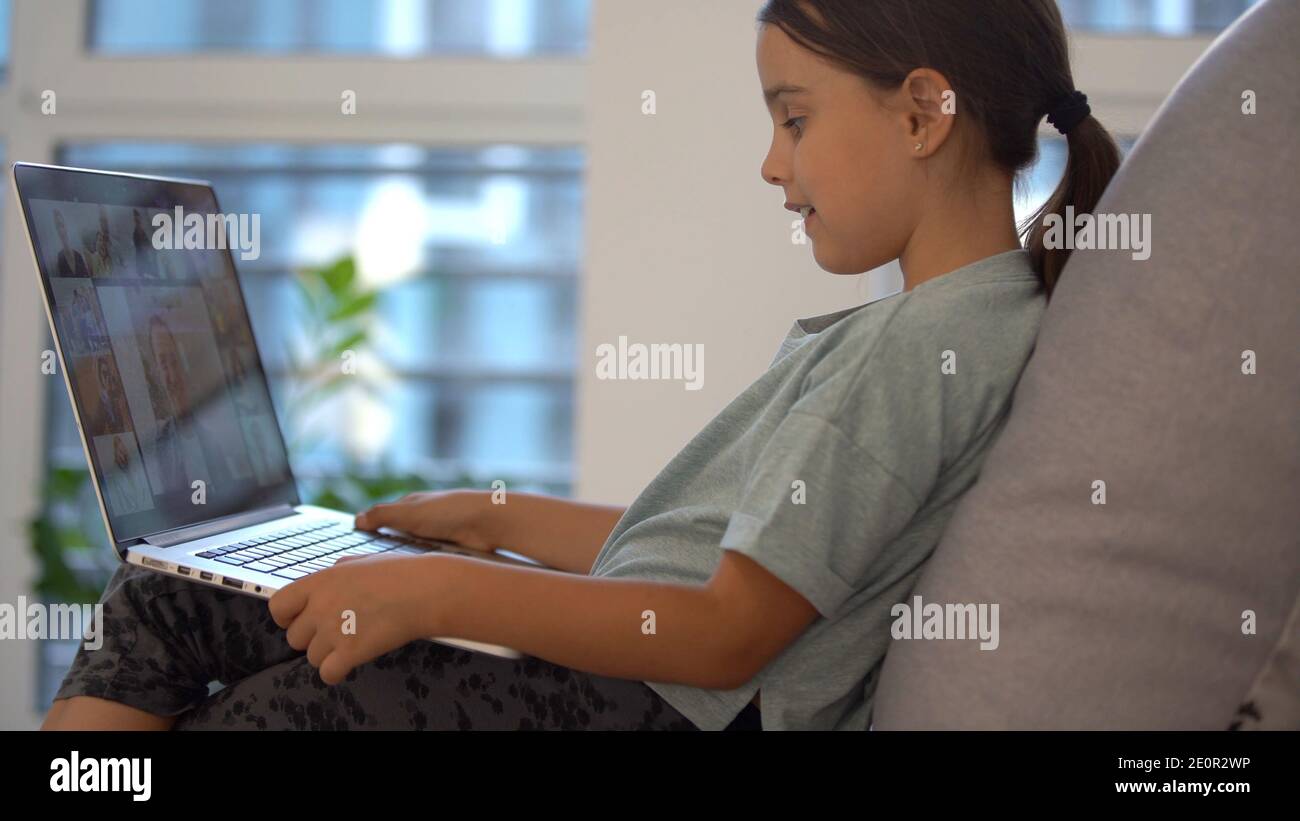 Cute little girl using laptop at home. Education, online study, home ...