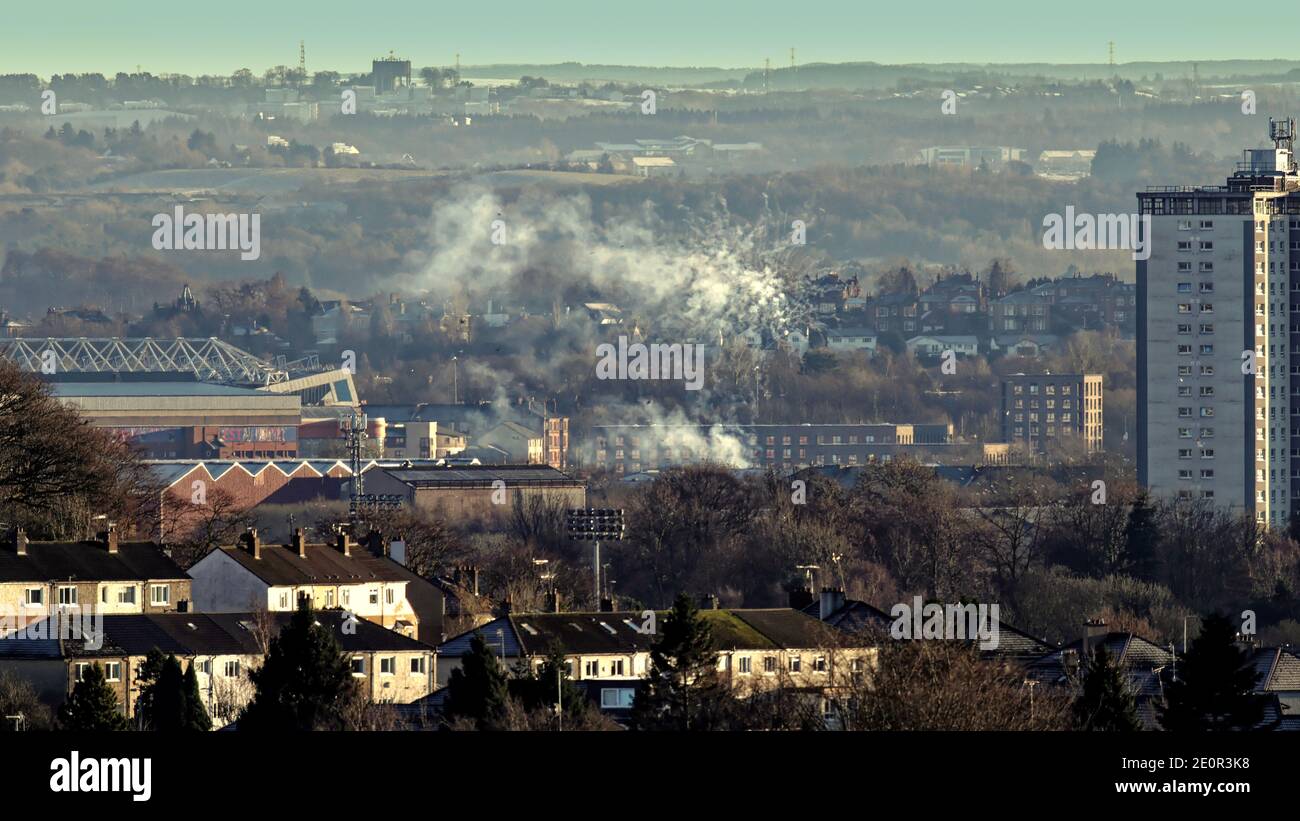 Glasgow, Scotland, UK, 2nd  December, 2021: Fireworks celebrate rangers win viewed from all over the city and pictured from 5 miles away as rangers win over Celtic the smoke poured over Govan. Credit: Gerard Ferry/Alamy Live News Stock Photo
