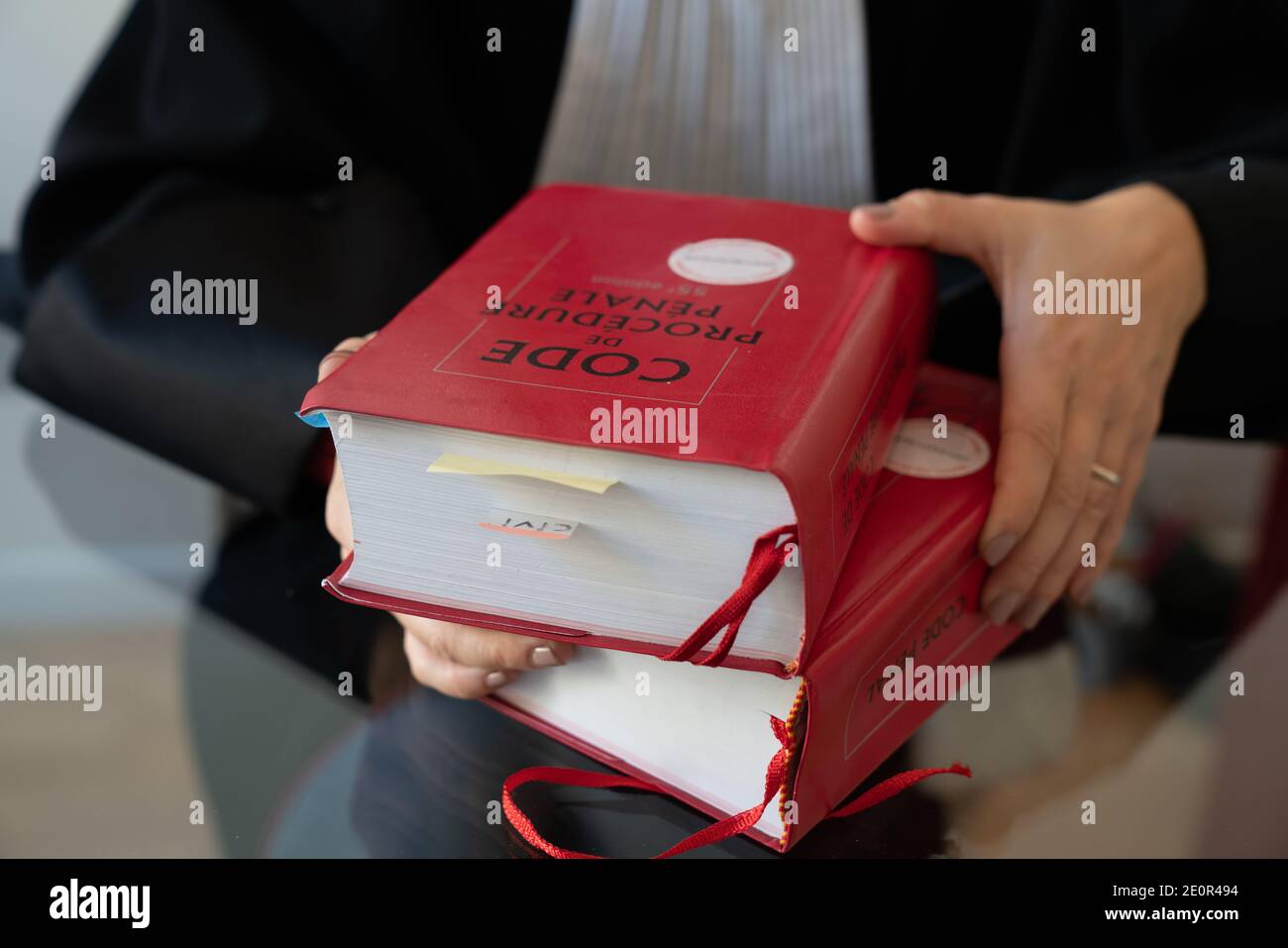 Law, French lawyer woman sitting with french red law book Stock Photo