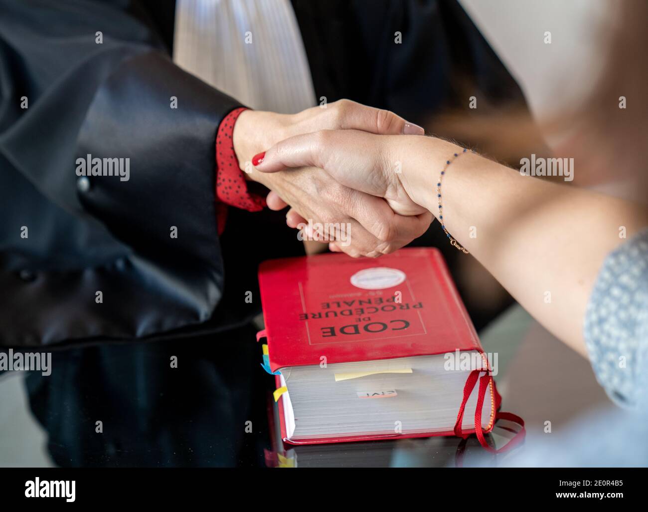 lawyer shakes hands with his client Stock Photo