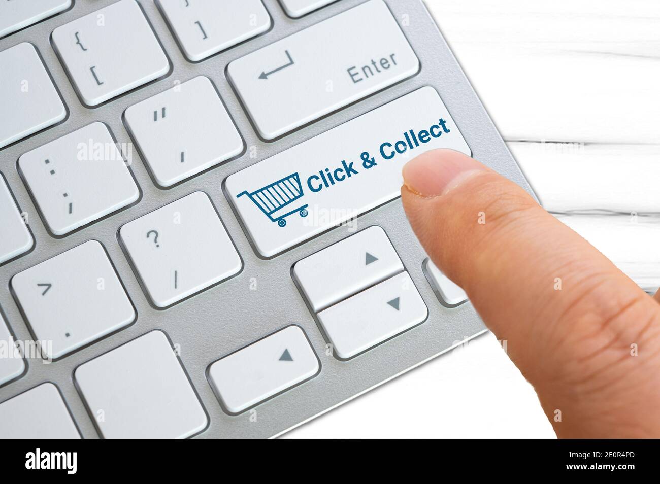 Click and collect concept - Keyboard buttons with shopping cart icon Stock Photo