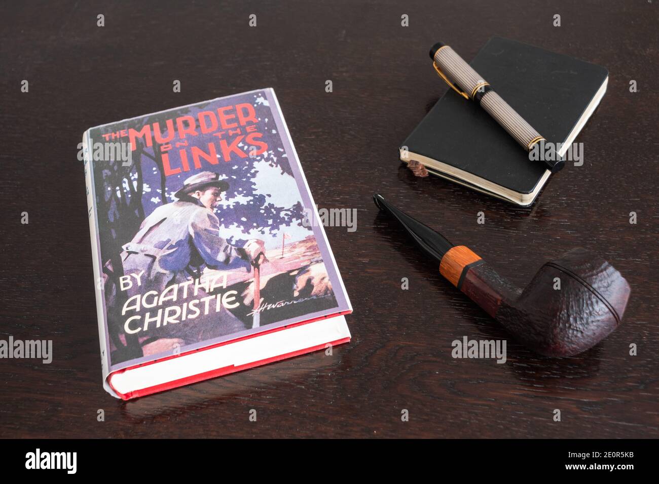 London, England, UK - January 2 2021: The Murder on the Links Book by Agatha Christie in a Facsimile First Edition with Tobacco Pipe, Fountian Pen and Stock Photo