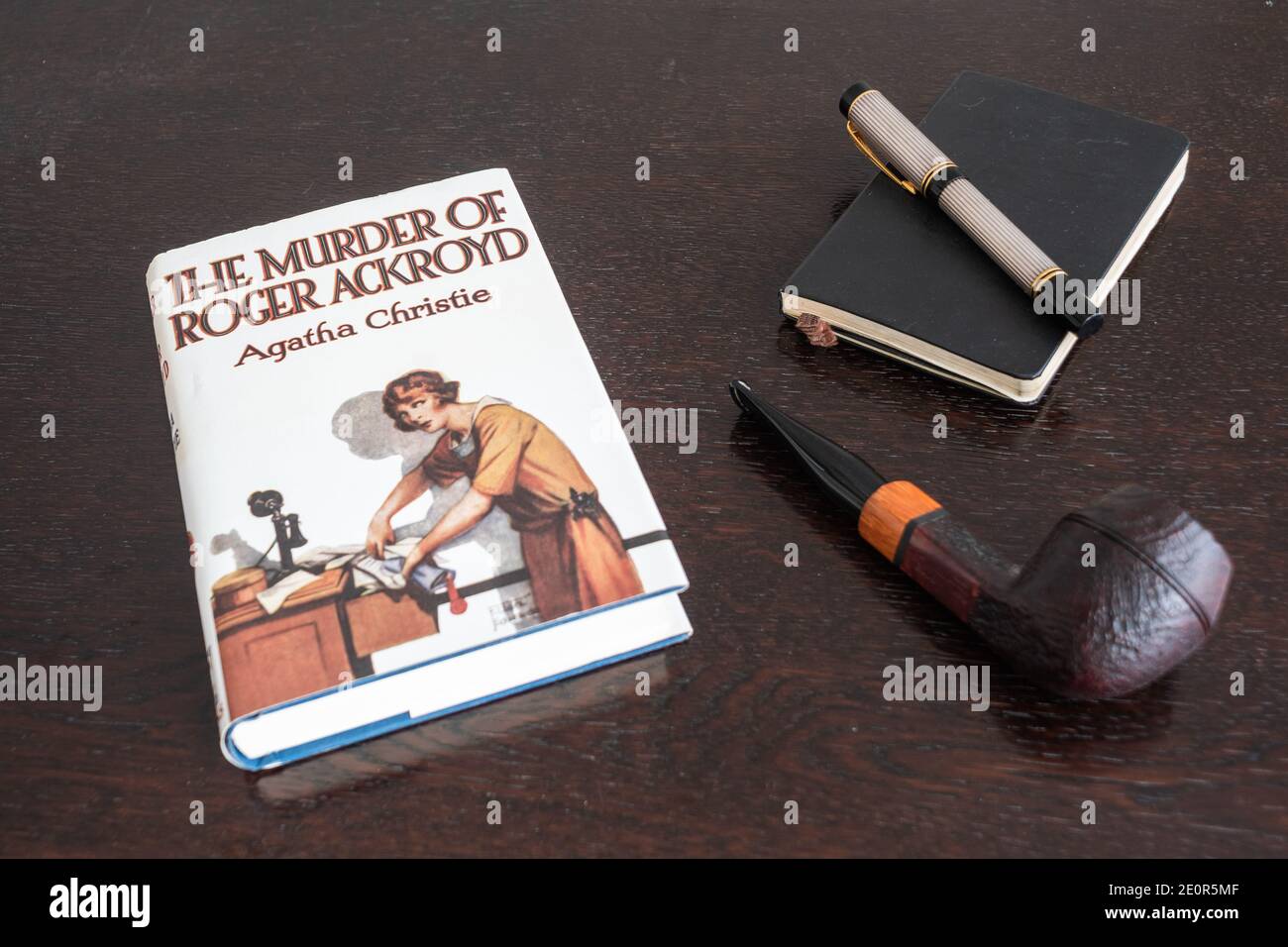 London, England, UK - January 2 2021: The Murder of Roger Ackroid Book by Agatha Christie in a Facsimile First Edition with Tobacco Pipe, Fountian Pen Stock Photo