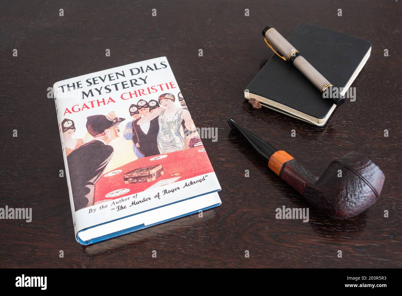 London, England, UK - January 2 2021: The Seven Dials Mystery Book by Agatha Christie in a Facsimile First Edition with Tobacco Pipe, Fountian Pen and Stock Photo