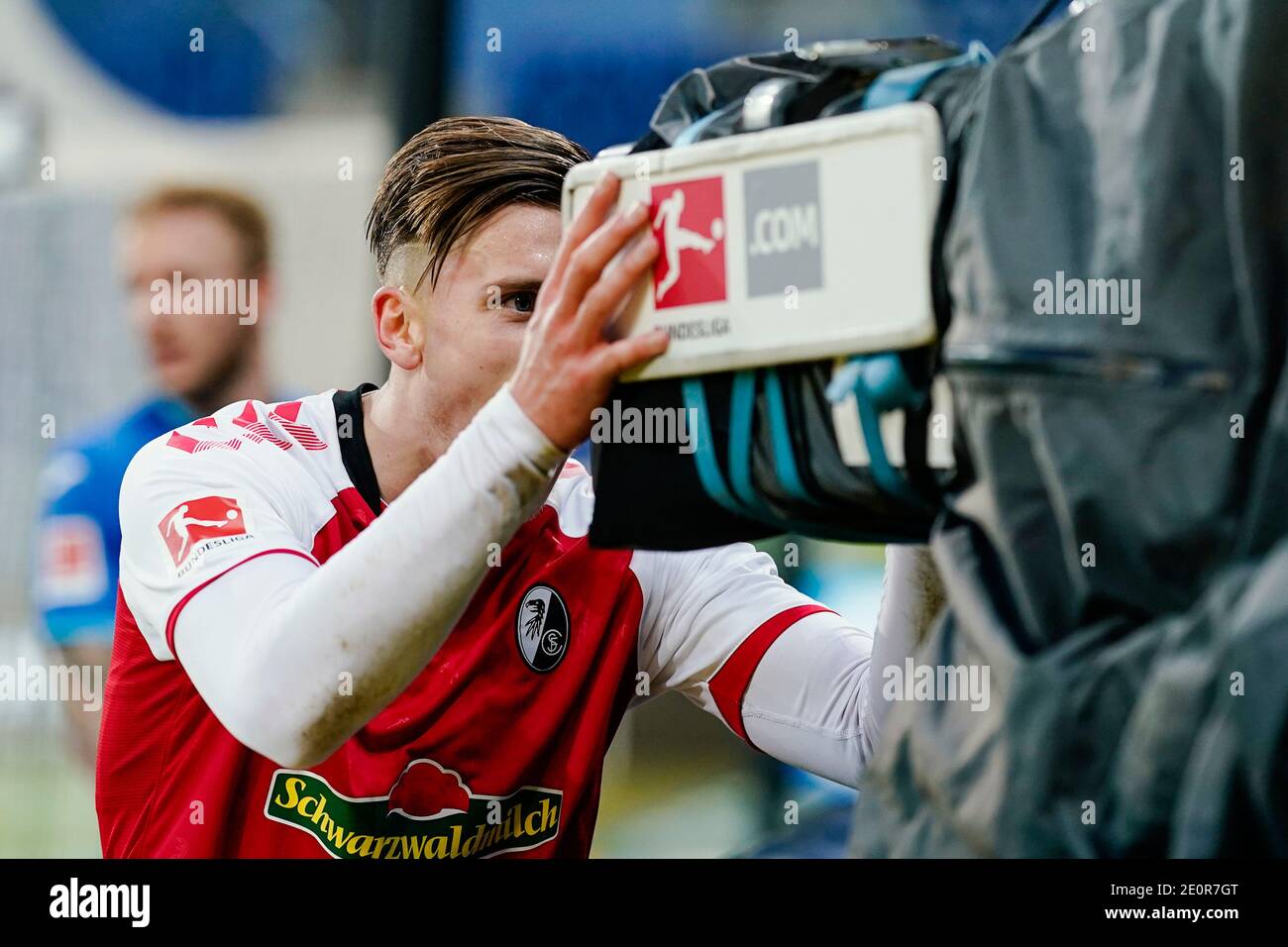 Sinsheim, Germany. 02nd Jan, 2021. Football: Bundesliga, TSG 1899  Hoffenheim - SC Freiburg, Matchday 14, PreZero Arena. Freiburg's Ermedin  Demirovic cheers into a TV camera about the goal for 0:3. Credit: Uwe