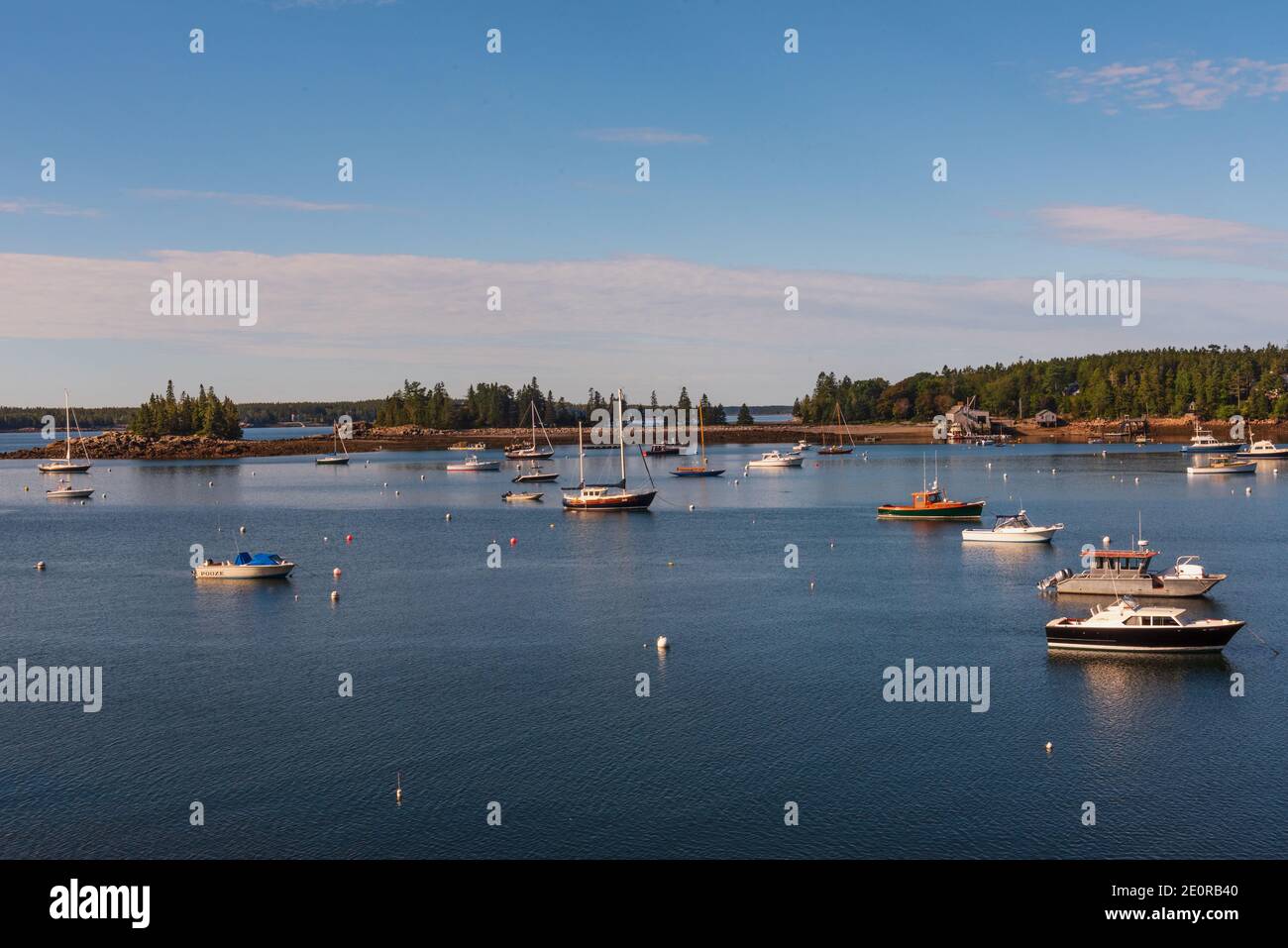 Seal Harbor, Maine, US -- Sept 22, 2016. Small boats are anchored in deep blue harbor waters on a crisp Autumn morning. Editorial Use Only. Stock Photo