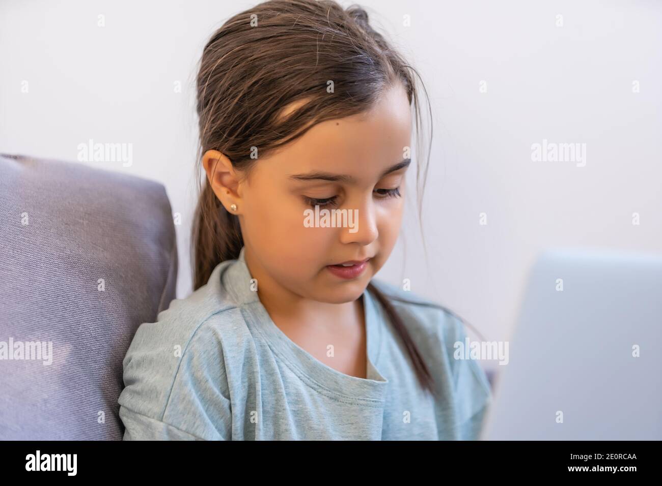 Cute little girl using laptop at home. Education, online study, home ...