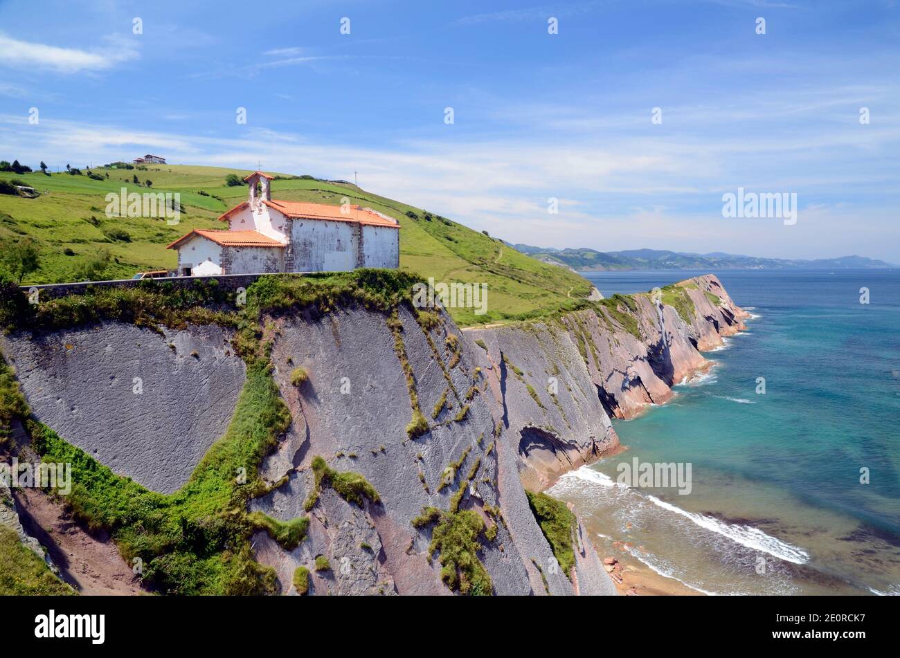 Hermitage of San Telmo next to the flysch of Zumaia, Gipuzkoa, Pais Vasco, Spain Stock Photo