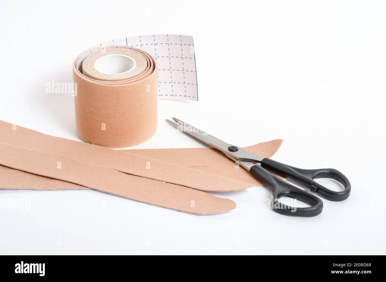 Beige tape for fixing muscles during sports and after injuries on a