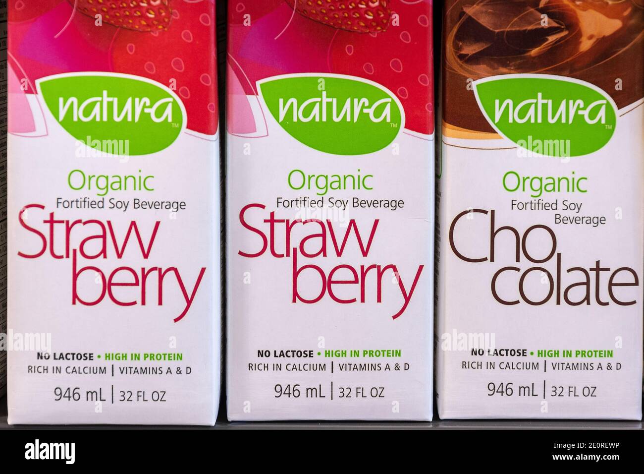 Boxes of Natura branded beverages with strawberry and chocolate flavors.   The merchandise is seen on a supermarket shelf. There are no people in the c Stock Photo