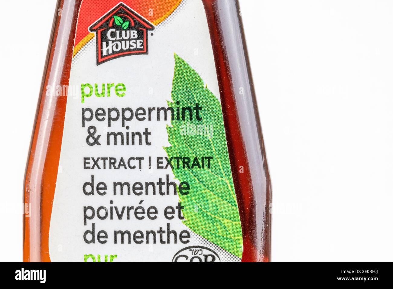 In this photo illustration, the front view of a Club House bottle of Pure Peppermint and Mint extract Stock Photo