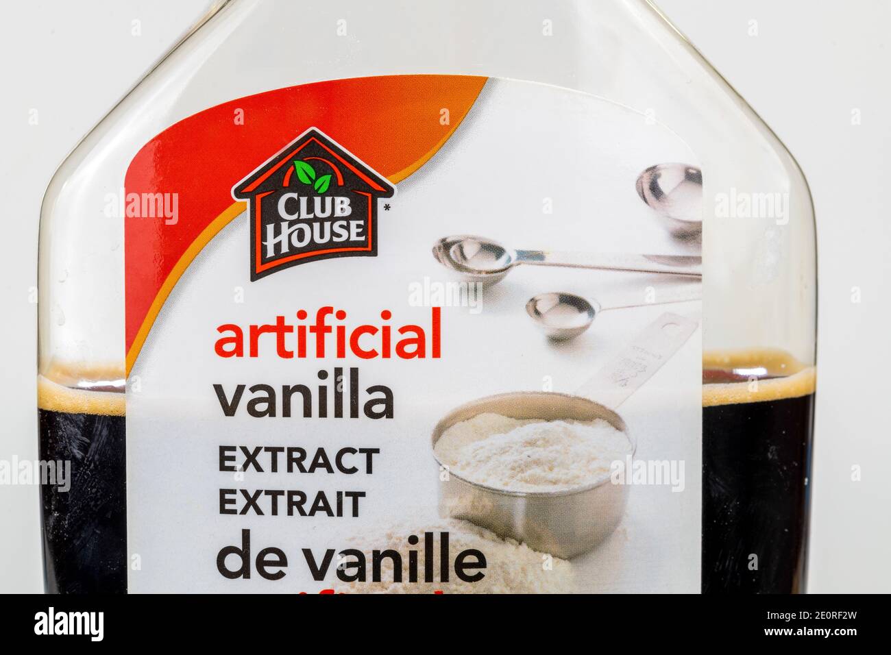 In this photo illustration, a front view of a Club House label in a bottle of Artificial Vanilla Extract Stock Photo