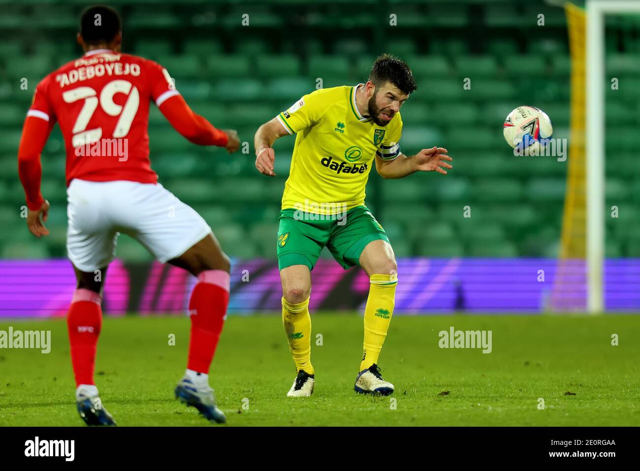 2nd January 2021; Carrow Road, Norwich, Norfolk, England, English Football League Championship Football, Norwich versus Barnsley; Grant Hanley of Norwich City careful as he heads the ball after suffering a head injury Stock Photo